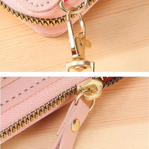 Reißverschluss der rosa Tasche